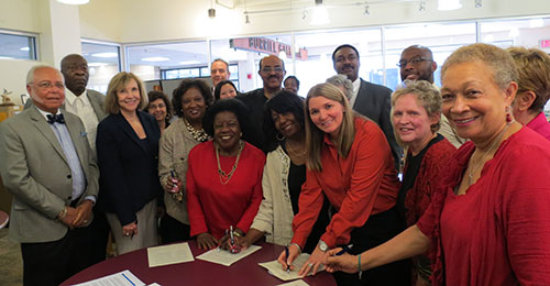 board of education and Dr. Foose signing partnership