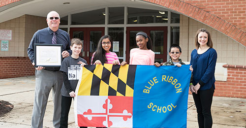 Photo of mount view middle school students with maryland blue ribbon flag