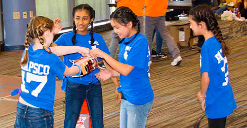 Patapsco Middle school team demonstrating prosthetic limb