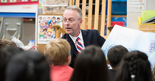 Dr. Martirano reading to an elementary class