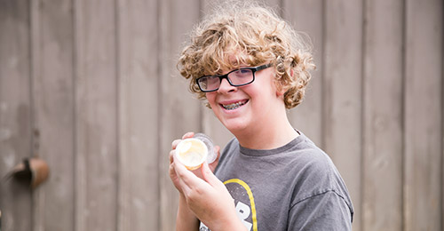 Student holding butter
